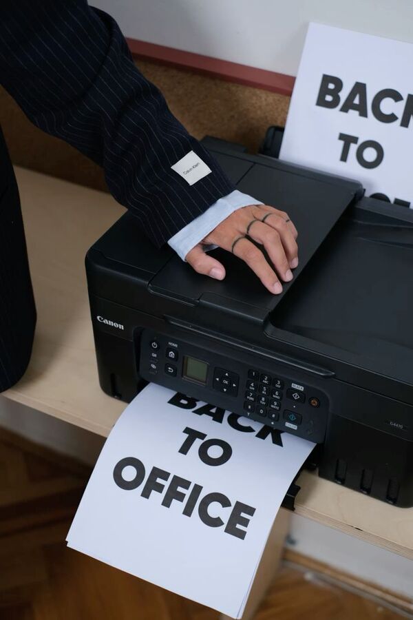 Printer printing a page that reads Back to office