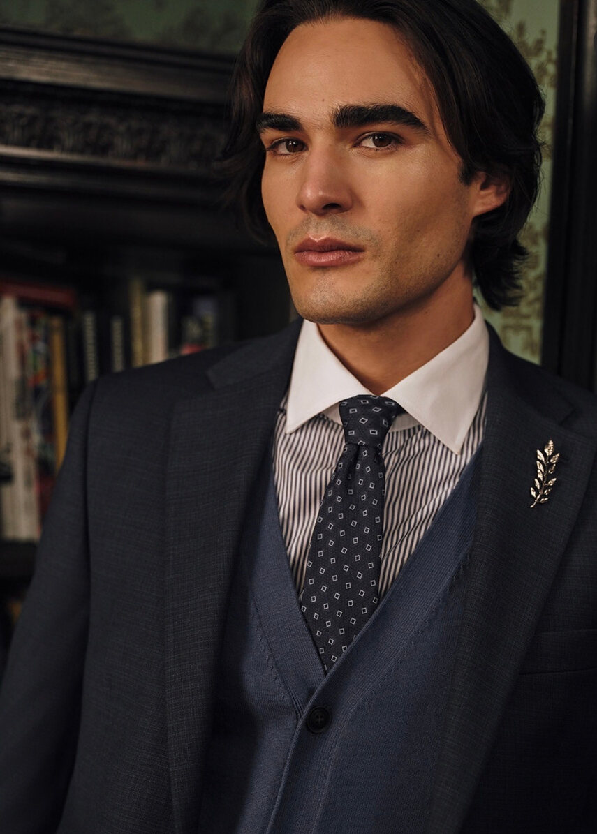 Tallia campaign image of a model in a navy three-piece suit