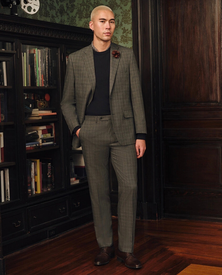 Published Tallia post of a model in an olive suit